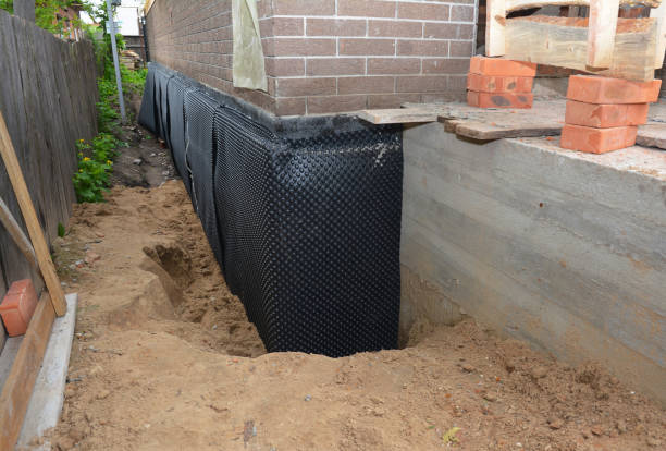 SJ Waterproofing Pros technician performing targeted Foundation Crack Repair assessment in West Newton, IN